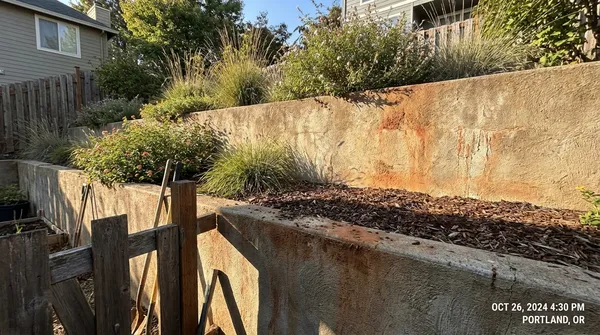 Poured concrete retaining wall on a sloped Morgan County lot near Hartselle, AL